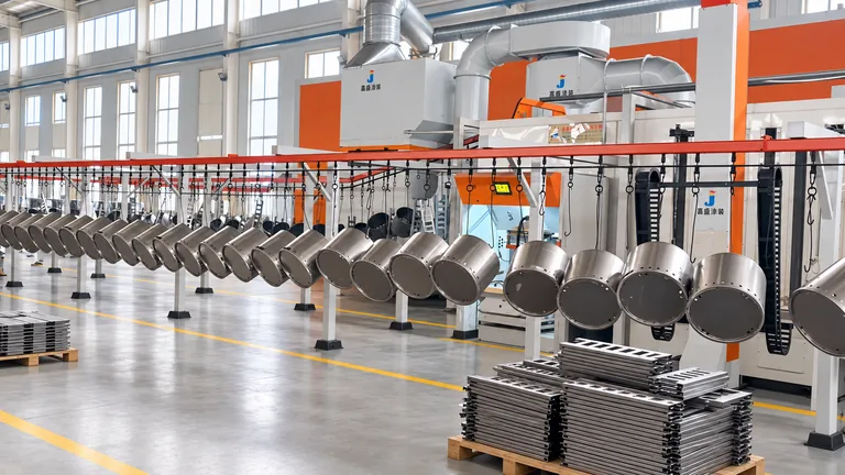 Finished metal components moving through the coating line