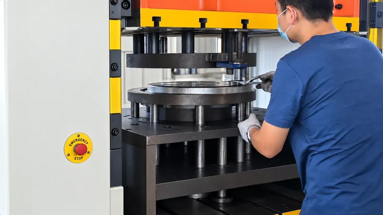 Operator at a hydraulic metal press