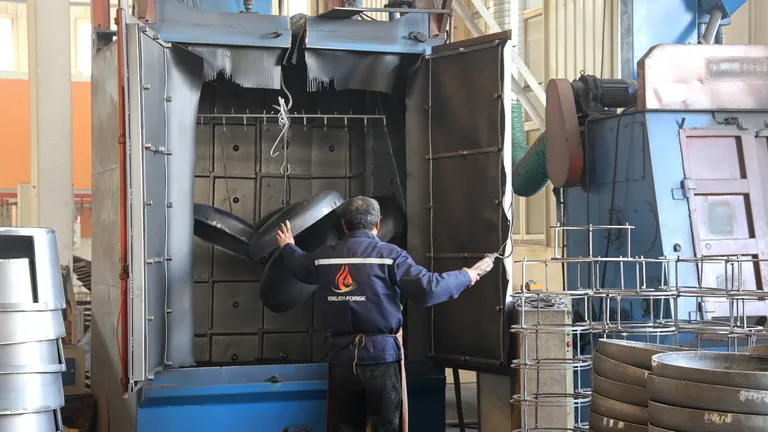 Operator at shot blasting equipment
